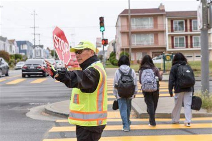Who are crossing guards employed?